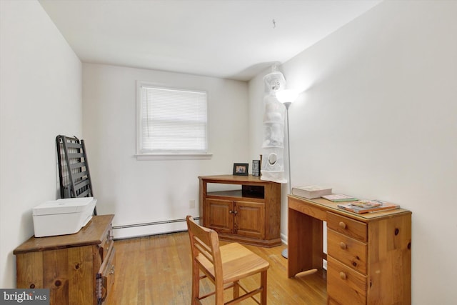 office area featuring a baseboard radiator and light hardwood / wood-style floors