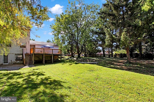 view of yard featuring a wooden deck