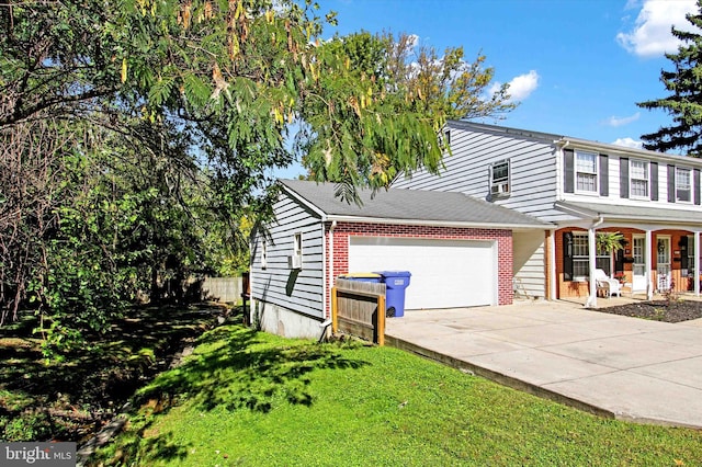 view of front of house with a front lawn and a garage