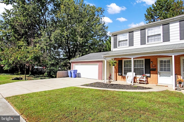 front facade featuring a garage, a porch, and a front yard