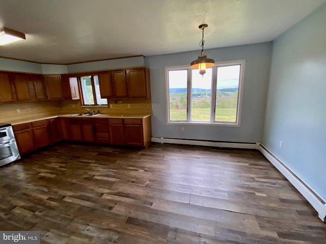 kitchen with decorative light fixtures, a baseboard heating unit, dark hardwood / wood-style floors, and stainless steel stove