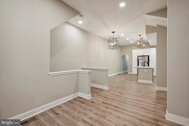 interior space with sink and light hardwood / wood-style floors