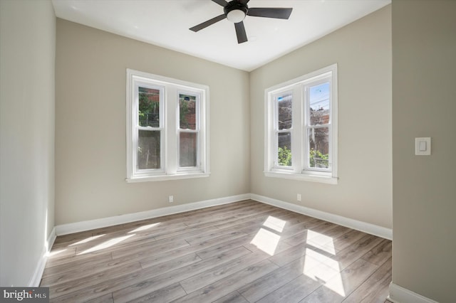 unfurnished room featuring ceiling fan, light hardwood / wood-style flooring, and plenty of natural light