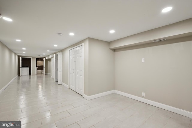 basement with light tile patterned flooring