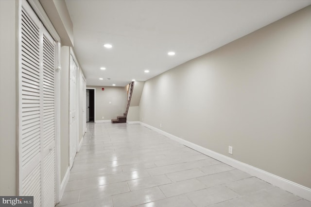 hallway with light tile patterned floors