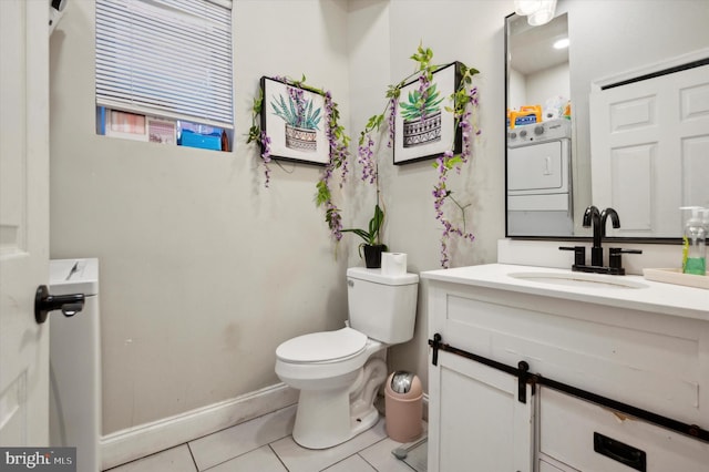 bathroom featuring vanity, tile patterned flooring, and toilet