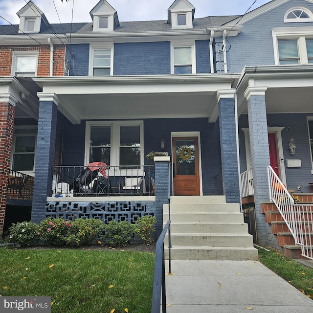 view of property featuring a porch