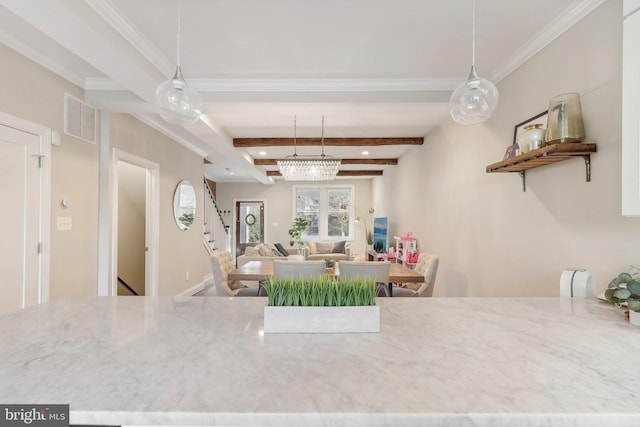 dining room featuring beam ceiling, ornamental molding, and a notable chandelier