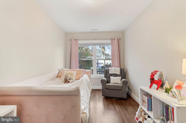 bedroom featuring dark wood-type flooring