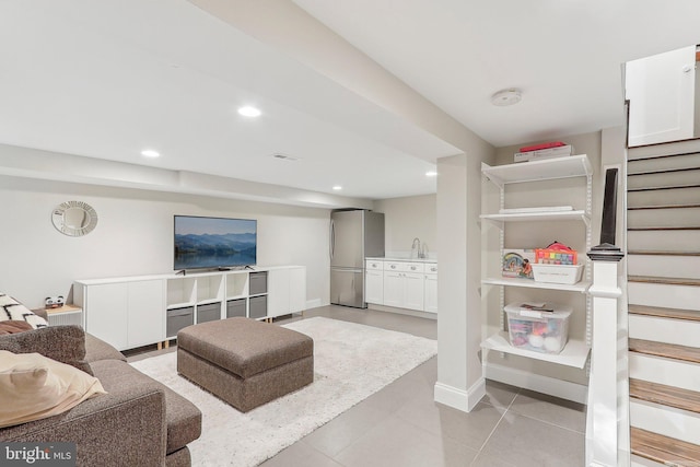 tiled living room featuring sink