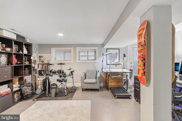 exercise room featuring light tile patterned flooring