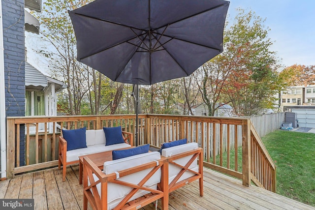 deck with a yard and an outdoor living space