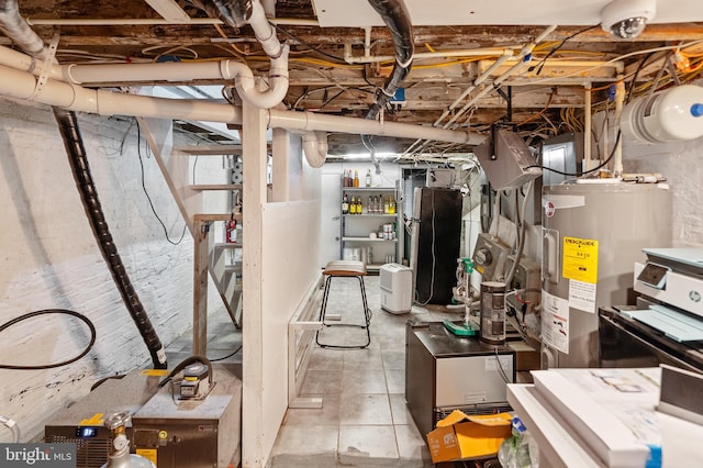 utility room featuring water heater