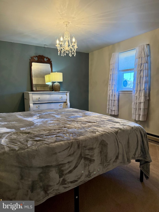 bedroom with carpet floors and a notable chandelier