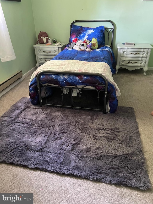 bedroom featuring a baseboard radiator and dark colored carpet