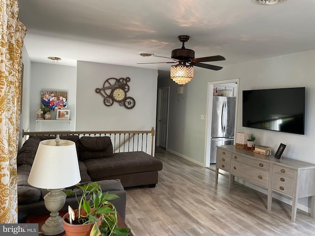 living room with hardwood / wood-style flooring and ceiling fan