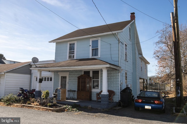 view of front of home with a porch and a trampoline