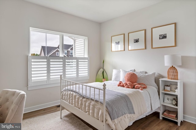 bedroom with hardwood / wood-style flooring