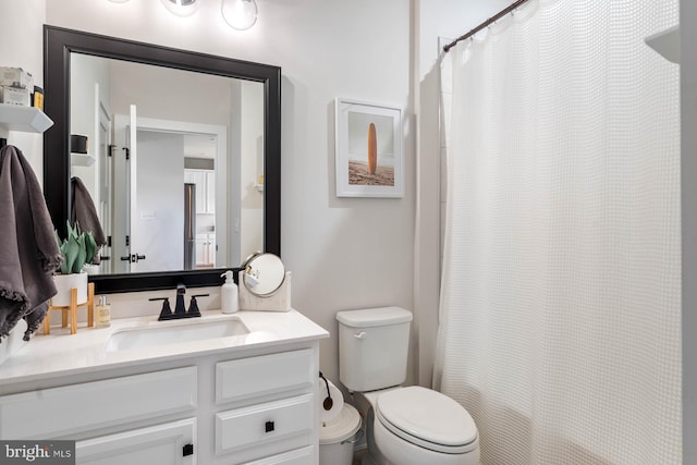 bathroom with vanity, toilet, and a shower with shower curtain