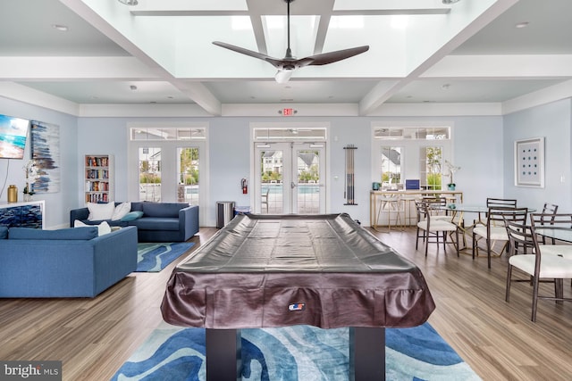 game room featuring pool table, beamed ceiling, light wood-type flooring, and ceiling fan