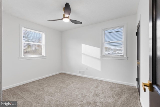 carpeted empty room with ceiling fan