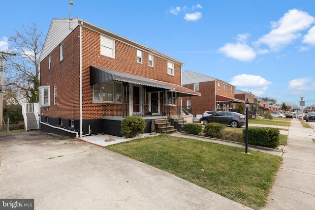 view of front of home with a front yard