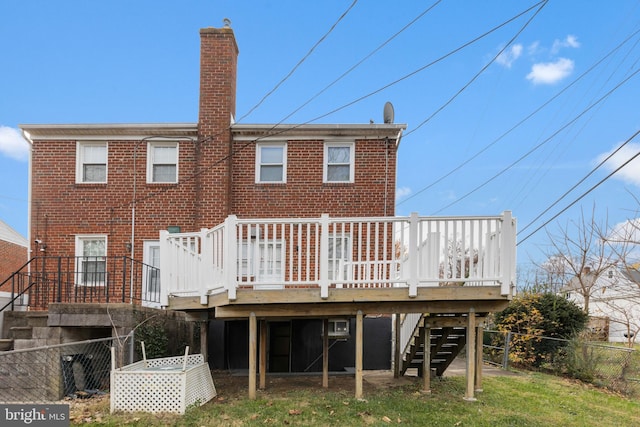 rear view of house with a wooden deck