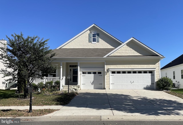 view of front facade featuring a garage and a porch