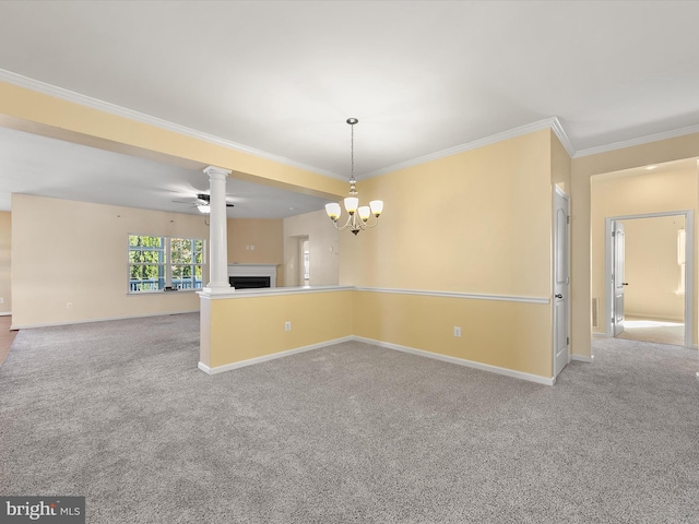 carpeted empty room with ornamental molding and ceiling fan with notable chandelier