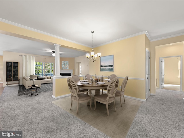 dining area with ornamental molding, light colored carpet, and ceiling fan with notable chandelier