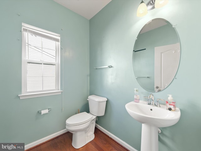 bathroom featuring toilet and hardwood / wood-style flooring