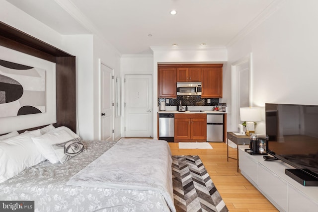 bedroom featuring light hardwood / wood-style floors, ornamental molding, and stainless steel fridge