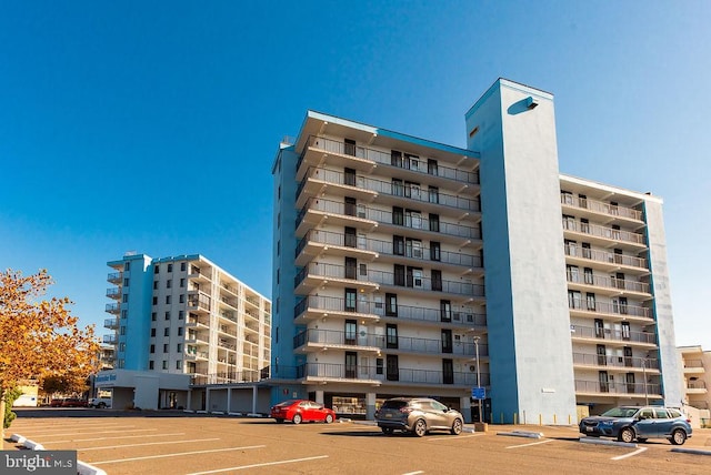 view of property with uncovered parking