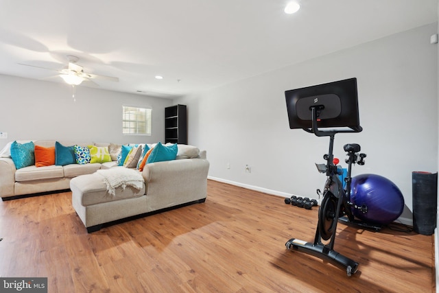 exercise area with ceiling fan and hardwood / wood-style flooring