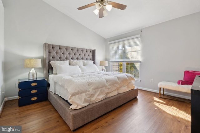 bedroom featuring vaulted ceiling, wood-type flooring, and ceiling fan