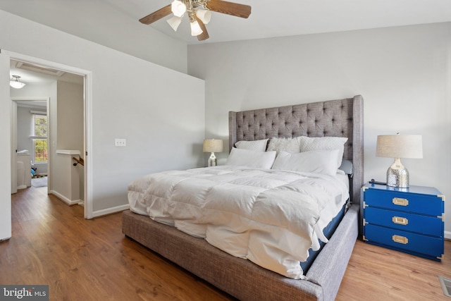 bedroom with hardwood / wood-style flooring and ceiling fan