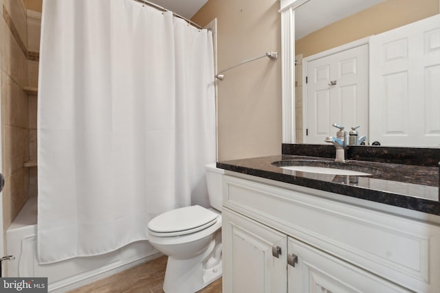 full bathroom featuring vanity, shower / bath combo, toilet, and wood-type flooring