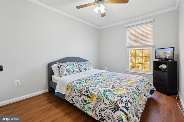 bedroom featuring crown molding, dark wood-type flooring, and ceiling fan