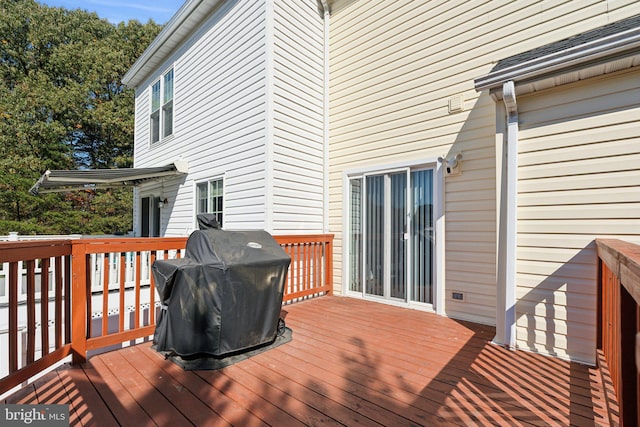 deck featuring a grill