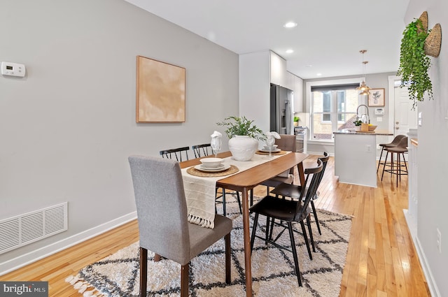 dining room featuring light wood-type flooring