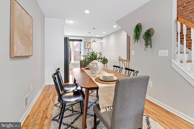 dining room with light hardwood / wood-style flooring