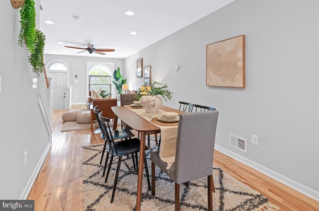 dining space featuring light wood-type flooring and ceiling fan