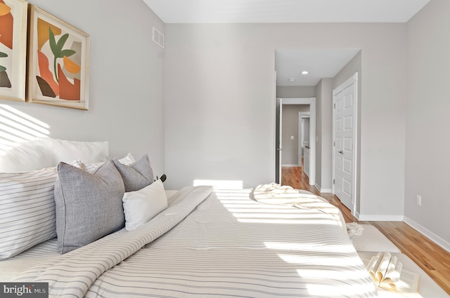 bedroom with light hardwood / wood-style floors