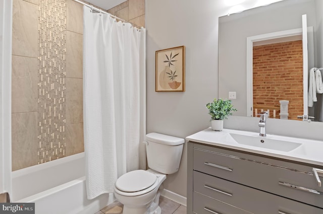 full bathroom with tile patterned flooring, shower / tub combo, vanity, and toilet