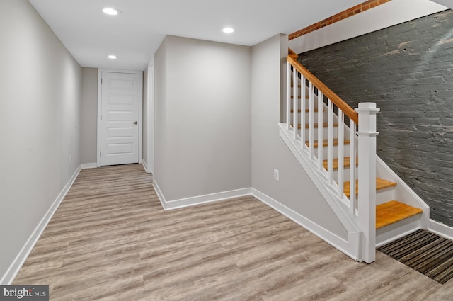 staircase featuring hardwood / wood-style flooring