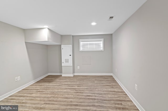 basement featuring light hardwood / wood-style floors