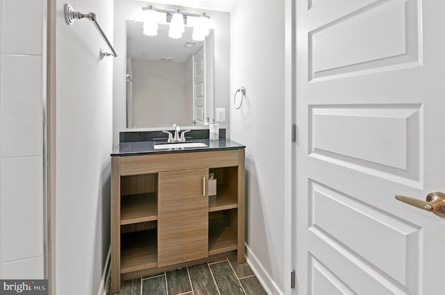 bathroom with vanity and wood-type flooring