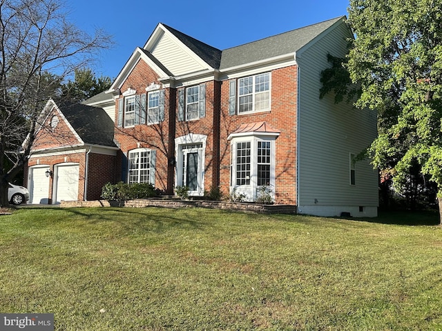 view of front facade featuring a front yard and a garage