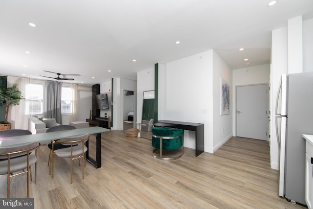 interior space with light hardwood / wood-style floors and ceiling fan