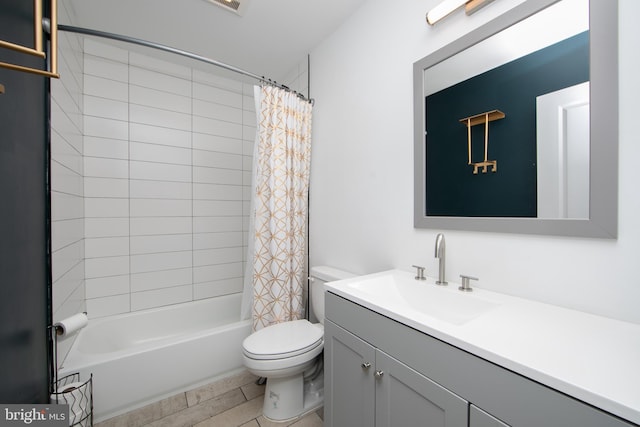 full bathroom featuring vanity, shower / bath combo, and toilet